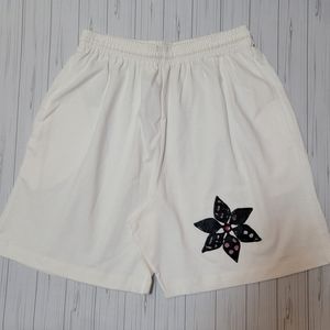 Shorts with Black Flower Embellishments